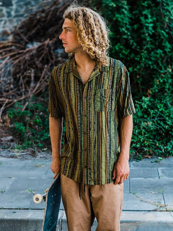 Men's High - Waisted Jeans in a Medium Wash for a Vintage - Style RevivalSkate Vitals Simon Bannerot Woven Short Sleeve Shirt - Dark Khaki Men's High - Waisted Jeans in a Medium Wash for a Vintage - Style RevivalSkate Vitals Simon Bannerot Woven Short Sleeve Shirt - Dark Khaki