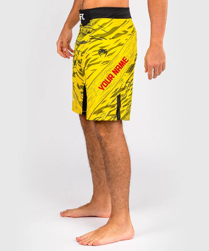 Men's zip - pocket canvas shorts for added functionality during travelUFC Fusion by Venum Personalized Authentic Fight Night Men's Fight Short - Long Fit - Yellow Men's zip - pocket canvas shorts for added functionality during travelUFC Fusion by Venum Personalized Authentic Fight Night Men's Fight Short - Long Fit - Yellow